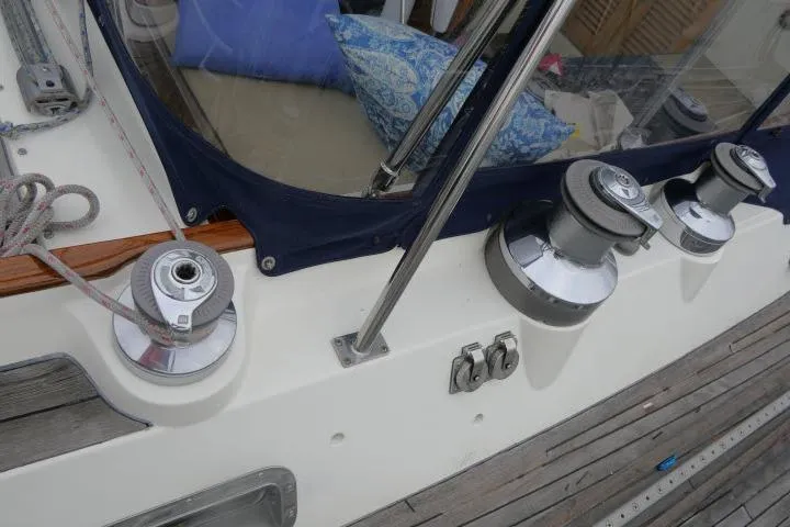 Majestic Yacht Photos Pics Deck view of 2006 Tayana 58 Deck Salon sailboat with winches and seating area.