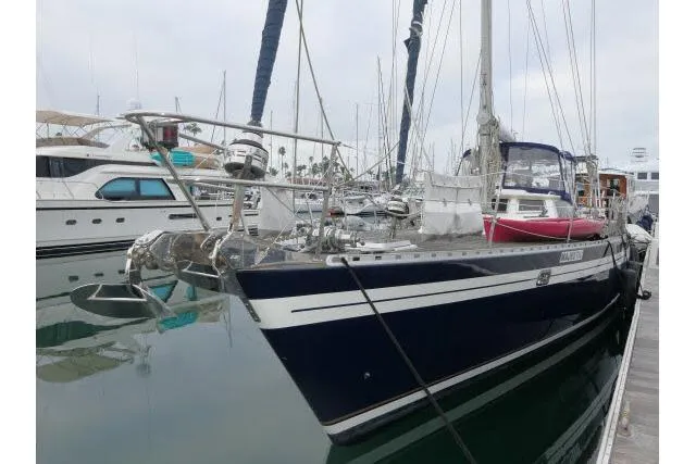 Majestic Yacht Photos Pics 2006 Tayana 58 Deck Salon yacht docked in marina, featuring sleek design and modern amenities.