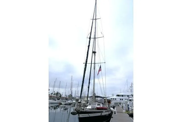 Majestic Yacht Photos Pics 2006 Tayana 58 Deck Salon sailboat docked at marina with American flag.