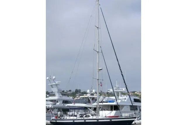 Majestic Yacht Photos Pics 2006 Tayana 58 Deck Salon yacht docked in a marina, surrounded by other boats.