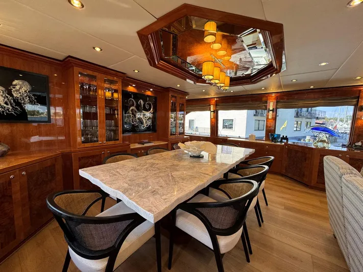 Cynderella Yacht Photos Pics Luxurious dining area in 2010 Hargrave Custom Raised Pilothouse yacht with elegant decor and large windows.