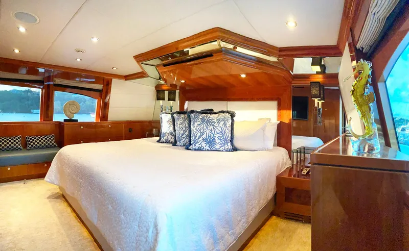 Cynderella Yacht Photos Pics Luxurious bedroom in 2010 Hargrave Custom Raised Pilothouse yacht with elegant wood finishes.