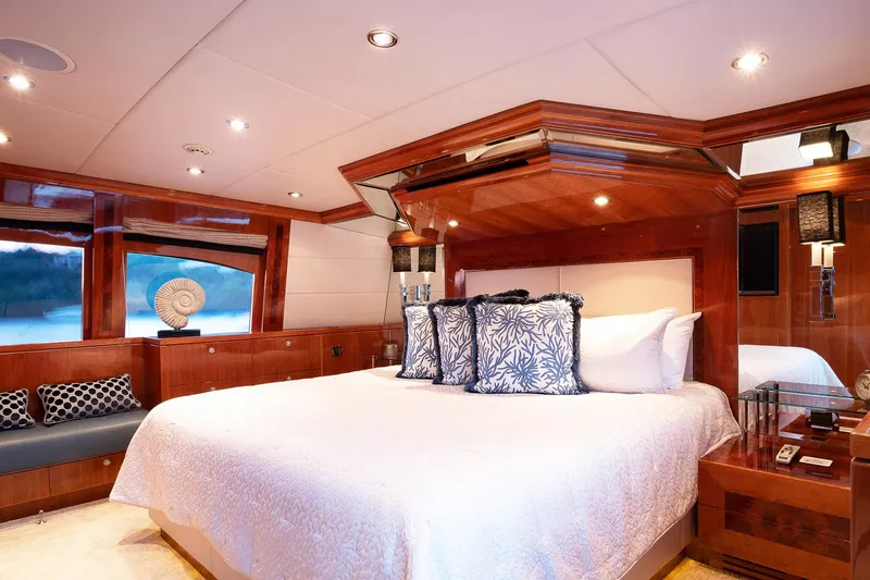 Cynderella Yacht Photos Pics Luxurious bedroom interior of 2010 Hargrave Custom Raised Pilothouse yacht with elegant wood finishes.