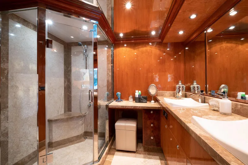 Cynderella Yacht Photos Pics Luxurious bathroom in 2010 Hargrave Custom Raised Pilothouse yacht with wood accents and glass shower.