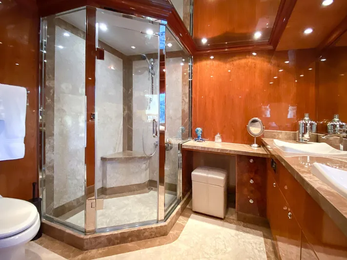 Cynderella Yacht Photos Pics Luxurious bathroom in 2010 Hargrave Custom Raised Pilothouse yacht with glass shower and wood finishes.