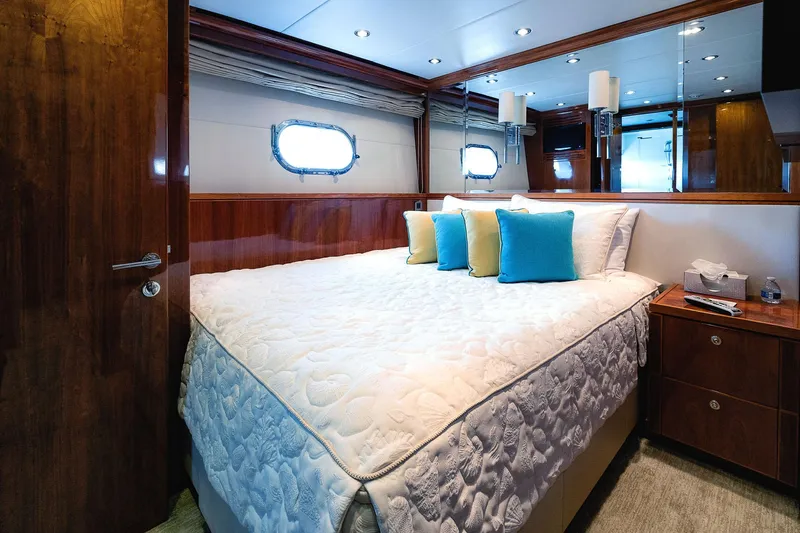 Cynderella Yacht Photos Pics Luxurious bedroom in 2010 Hargrave Custom Raised Pilothouse yacht with elegant wood paneling.
