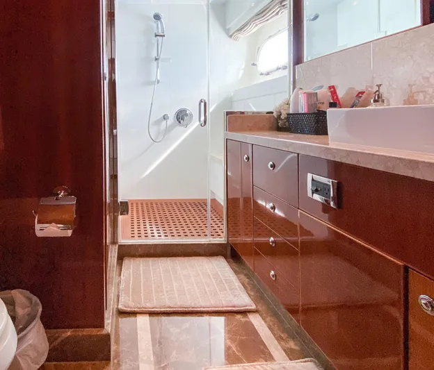 Cynderella Yacht Photos Pics Luxurious bathroom in 2010 Hargrave Custom Raised Pilothouse yacht, featuring elegant wood cabinetry.