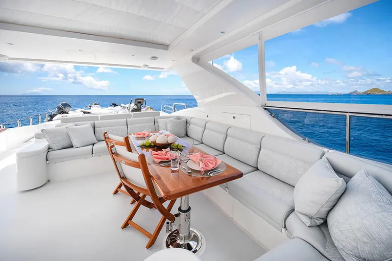 Cynderella Yacht Photos Pics Luxurious 2010 Hargrave Custom Raised Pilothouse yacht with elegant outdoor seating and ocean view.