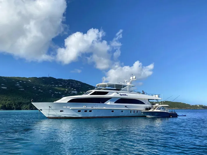 Cynderella Yacht Photos Pics 2010 Hargrave Custom Raised Pilothouse yacht on clear blue water, scenic background.