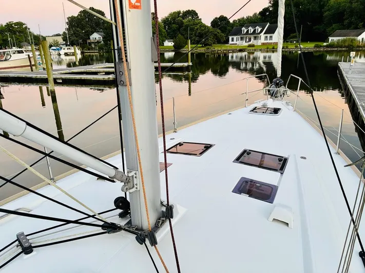  Yacht Photos Pics Beneteau Oceanis 45 sailboat docked in a serene marina, 2017 model.