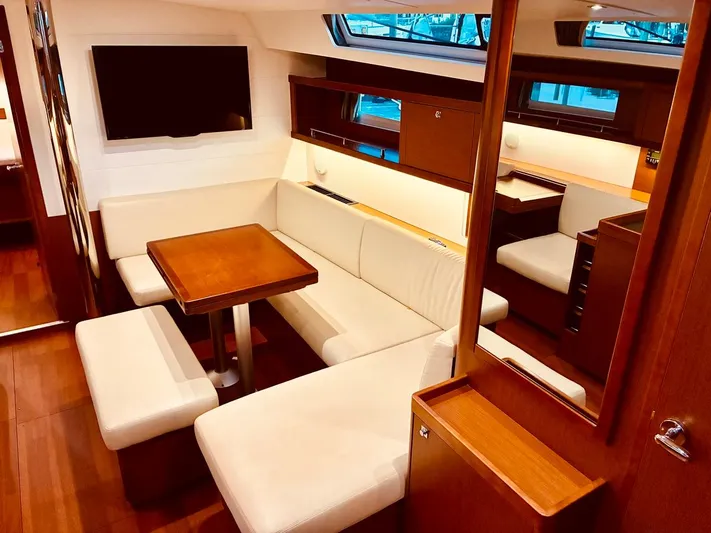  Yacht Photos Pics Luxurious interior of 2017 Beneteau Oceanis 45 yacht with elegant seating and modern amenities.