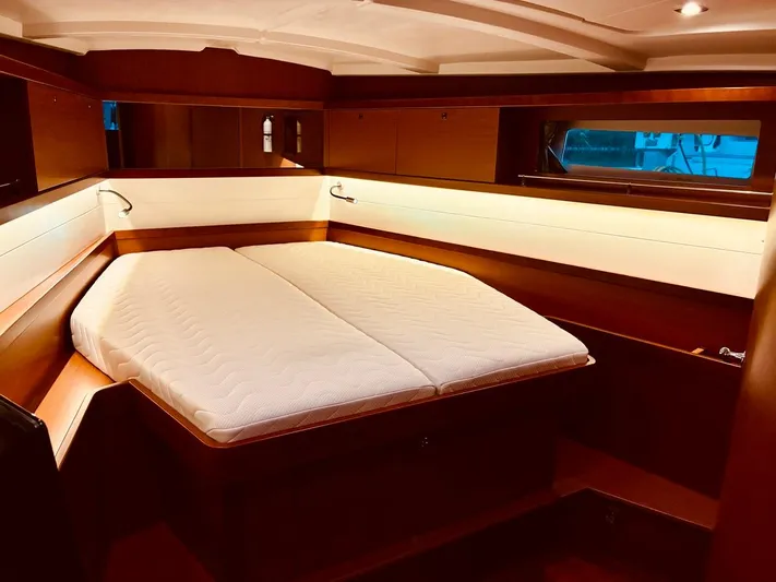  Yacht Photos Pics Luxurious cabin interior of 2017 Beneteau Oceanis 45 yacht with cozy bed.