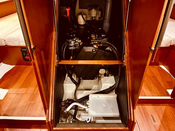  Yacht Photos Pics Engine compartment of a 2017 Beneteau Oceanis 45 sailboat, showcasing mechanical components.