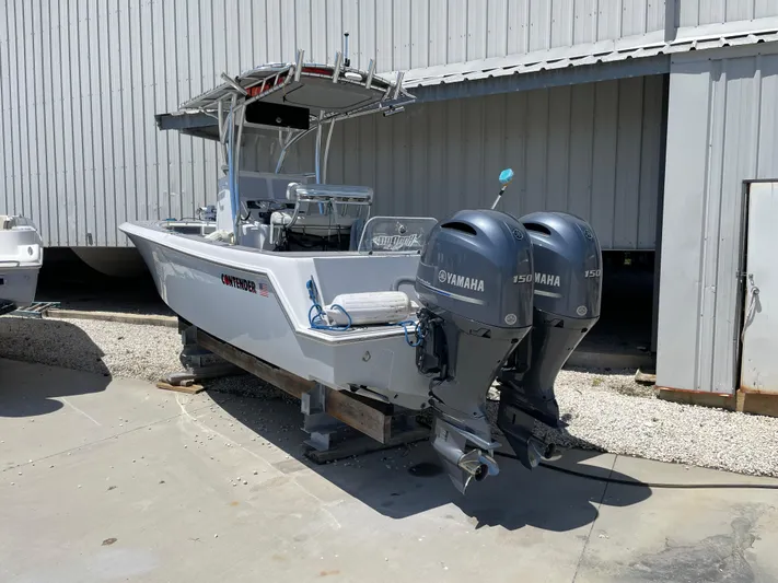  Yacht Photos Pics 2022 Contender 25 Tournament boat with dual Yamaha engines, parked outdoors.