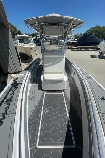  Yacht Photos Pics 2022 Contender 25 Tournament boat with sleek design and modern features, docked outdoors.