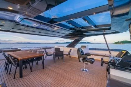 Evita Yacht Photos Pics Luxurious 2025 Custom NAUTICKS 62 yacht deck with seating and ocean view.