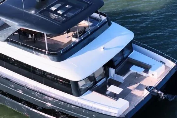 Evita Yacht Photos Pics Luxurious 2025 Custom NAUTICKS 62 yacht with spacious deck and modern design on the water.