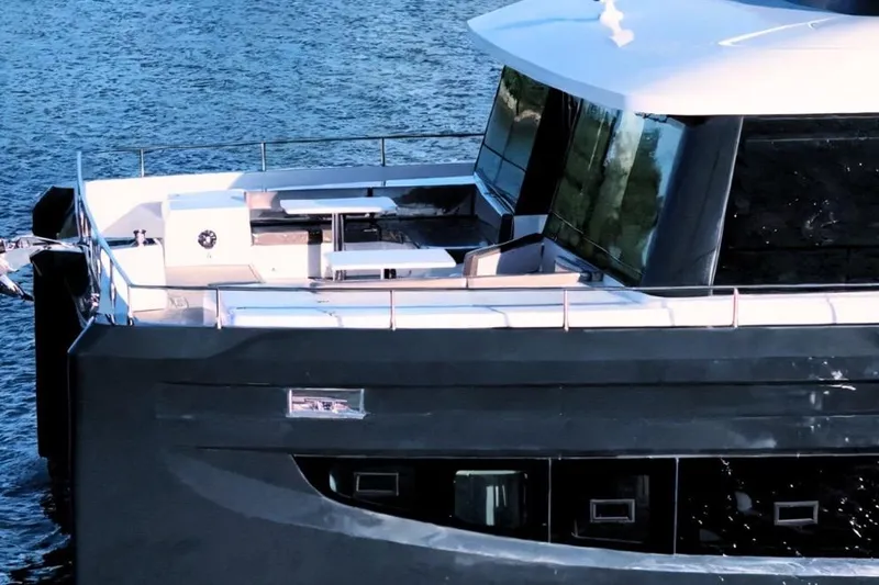 Evita Yacht Photos Pics Luxurious 2025 Custom NAUTICKS 62 yacht on serene blue waters.