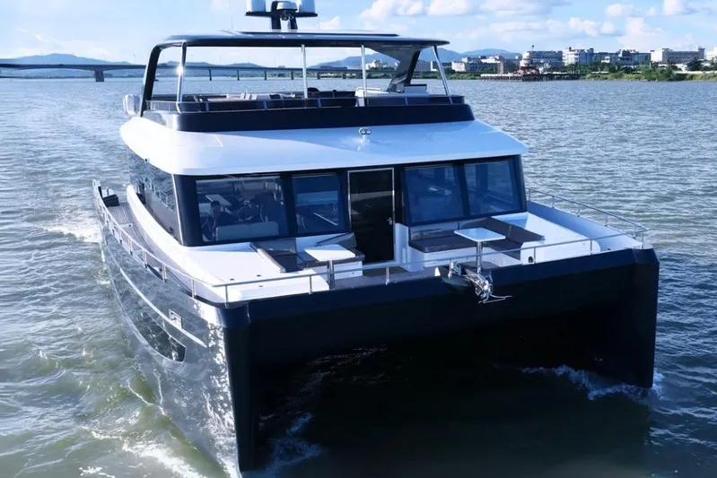 Evita Yacht Photos Pics Custom NAUTICKS 62 yacht cruising on a sunny day, 2025 model.