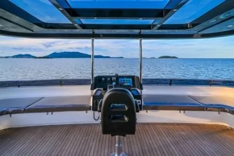 Evita Yacht Photos Pics Luxurious 2025 Custom NAUTICKS 62 yacht helm with panoramic ocean view.