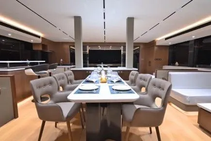 Evita Yacht Photos Pics Luxurious dining area on 2025 Custom NAUTICKS 62 yacht, featuring elegant seating and modern design.