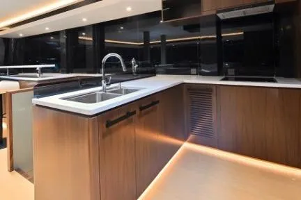Evita Yacht Photos Pics Luxurious kitchen interior of 2025 Custom NAUTICKS 62 yacht with modern fixtures.