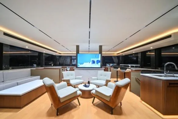 Evita Yacht Photos Pics Luxurious interior of 2025 Custom NAUTICKS 62 yacht with modern seating and elegant design.