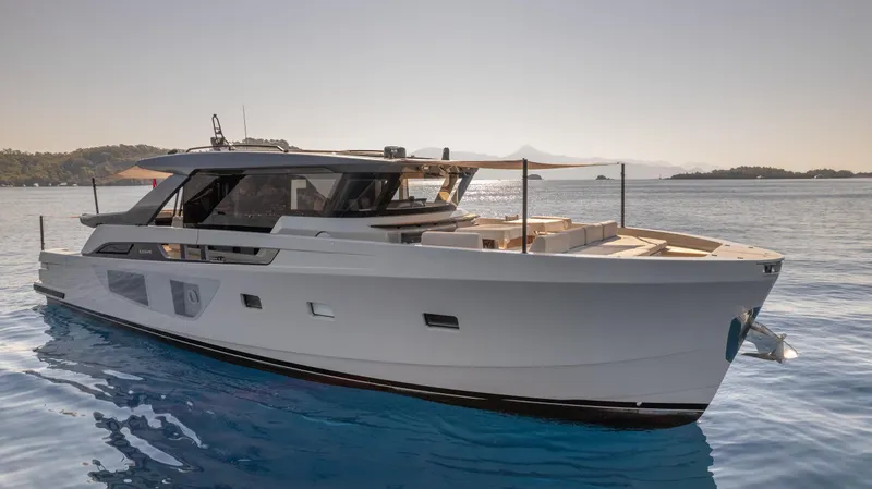 Mama Punch Yacht Photos Pics 2021 Bluegame BGX70 yacht cruising on calm waters.