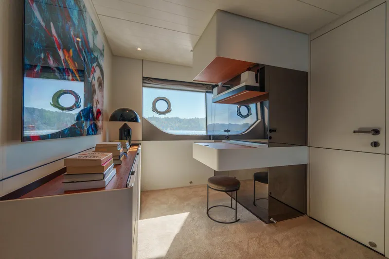 Mama Punch Yacht Photos Pics Luxurious interior of 2021 Bluegame BGX70 yacht with modern decor and scenic window views.