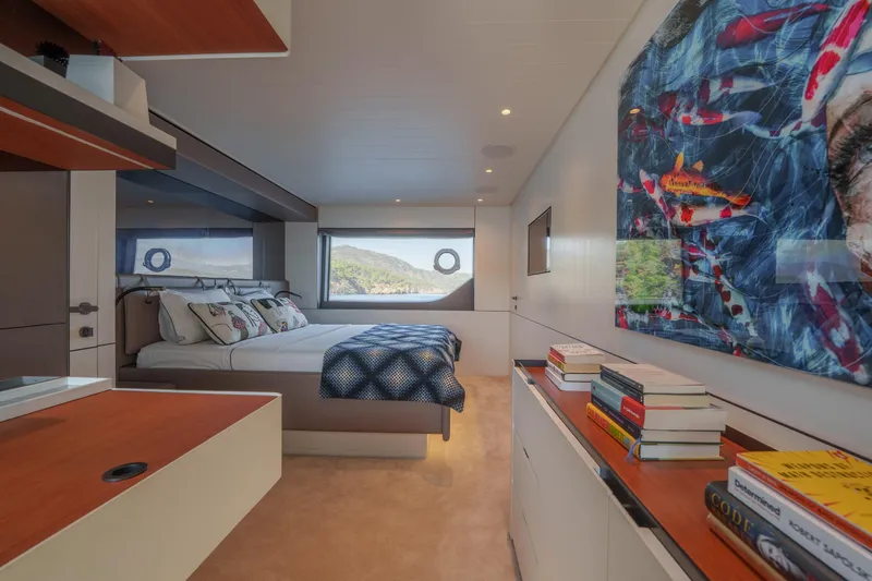 Mama Punch Yacht Photos Pics Luxurious 2021 Bluegame BGX70 yacht bedroom with modern decor and scenic window view.