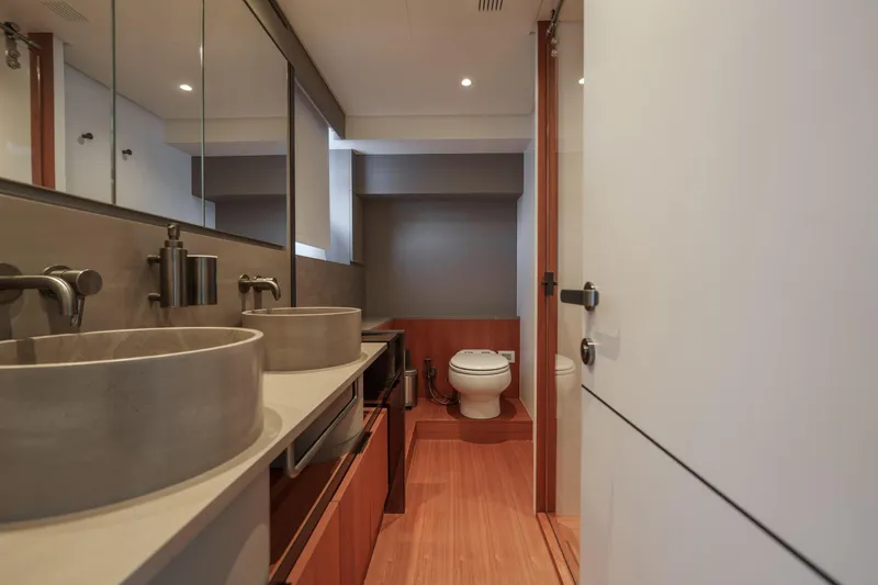 Mama Punch Yacht Photos Pics Luxury bathroom interior on 2021 Bluegame BGX70 yacht, featuring modern fixtures and dual sinks.