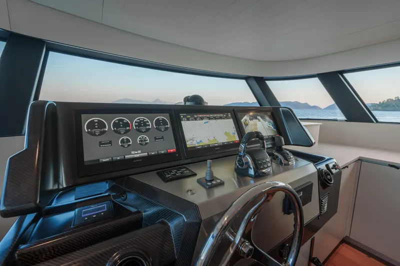 Mama Punch Yacht Photos Pics 2021 Bluegame BGX70 yacht cockpit with advanced navigation systems and panoramic windows.