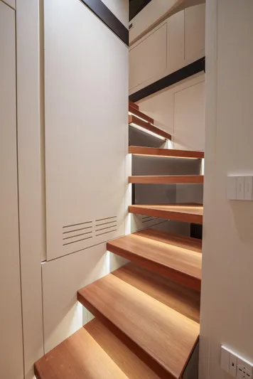 Mama Punch Yacht Photos Pics Staircase inside 2021 Bluegame BGX70 yacht, featuring sleek wooden steps and modern design.