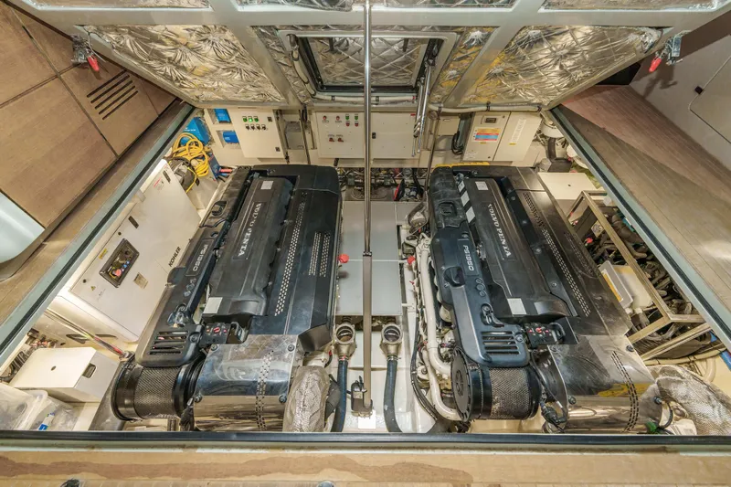 Mama Punch Yacht Photos Pics Engine room of 2021 Bluegame BGX70 yacht, featuring dual powerful engines and advanced machinery.