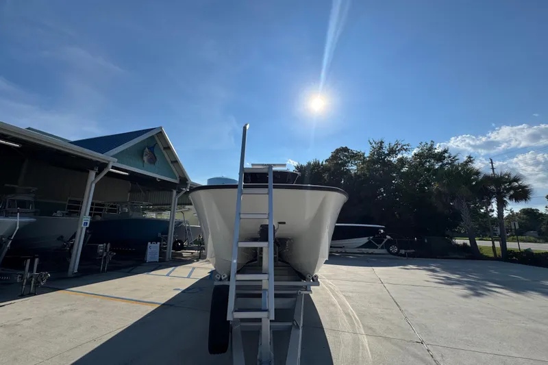  Yacht Photos Pics 2023 Invincible 35 Catamaran in sunny outdoor showroom setting.