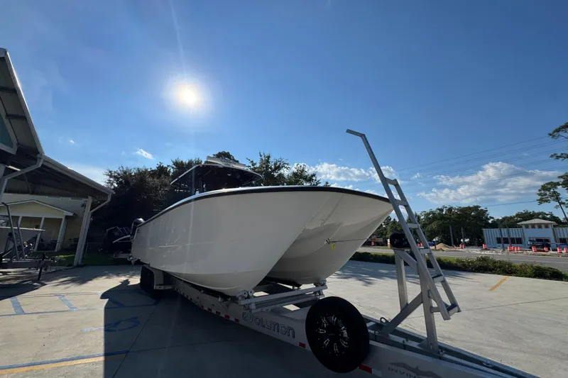  Yacht Photos Pics 2023 Invincible 35 Catamaran on trailer under sunny sky.