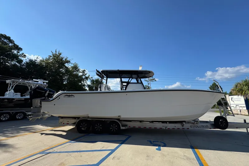  Yacht Photos Pics 2023 Invincible 35 Catamaran on trailer under clear blue sky.