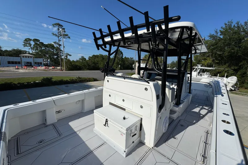  Yacht Photos Pics 2023 Invincible 35 Catamaran with spacious deck and modern design, docked outdoors.