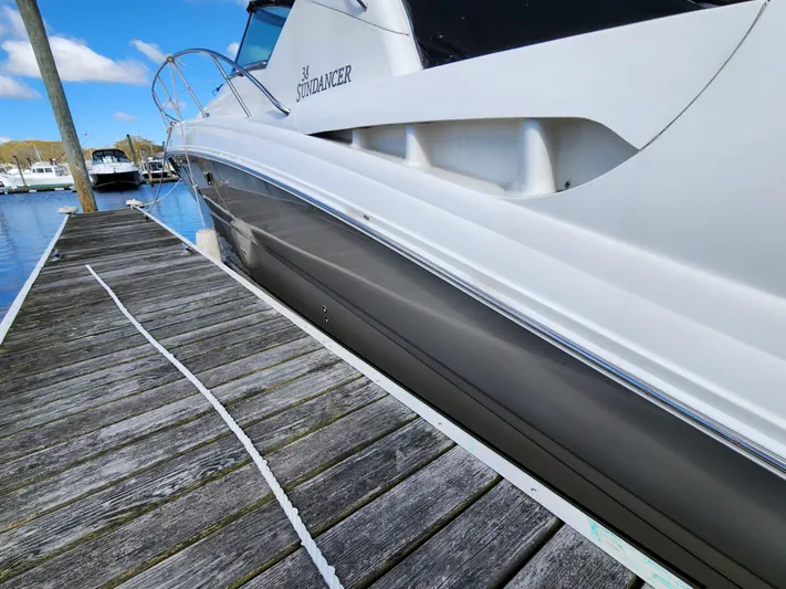  Yacht Photos Pics 2006 Sea Ray 38 Sundancer yacht docked at marina, clear sky background.