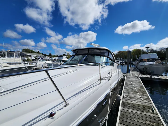 Yacht Photos Pics 2006 Sea Ray 38 Sundancer docked at marina under blue sky.
