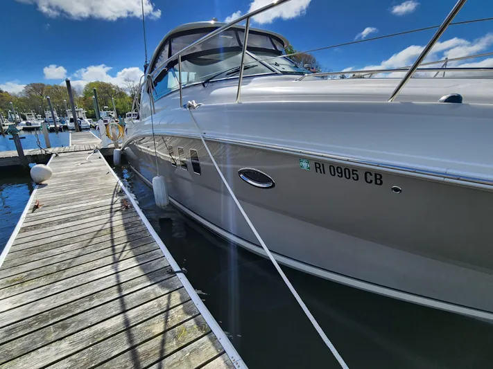  Yacht Photos Pics 2006 Sea Ray 38 Sundancer yacht docked at marina under blue sky.