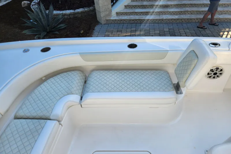  Yacht Photos Pics 2020 Caymas 28 HB boat interior with cushioned seating and speaker.