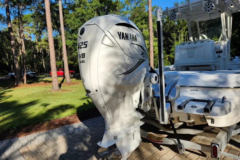  Yacht Photos Pics 2020 Caymas 28 HB boat with Yamaha 425 V8 engine in a wooded area.