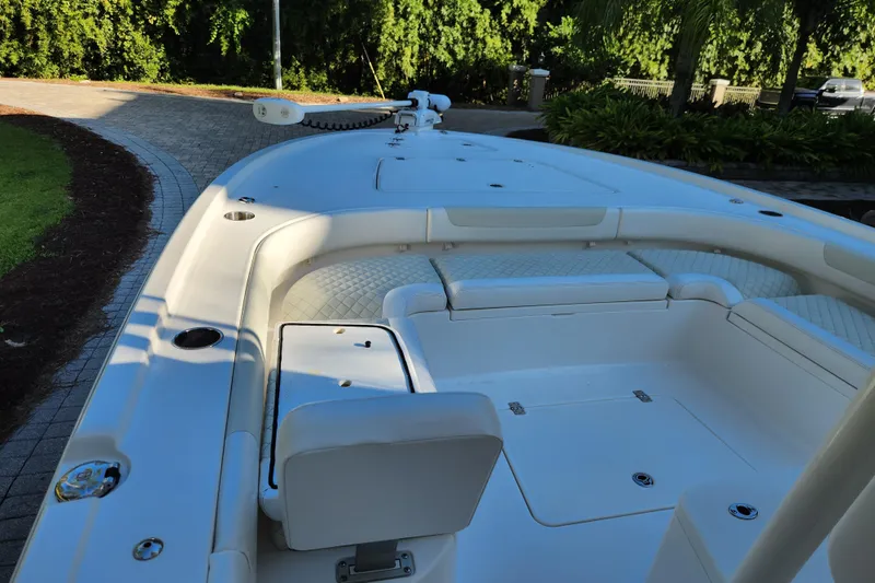  Yacht Photos Pics 2020 Caymas 28 HB boat interior with cushioned seating and storage compartments.