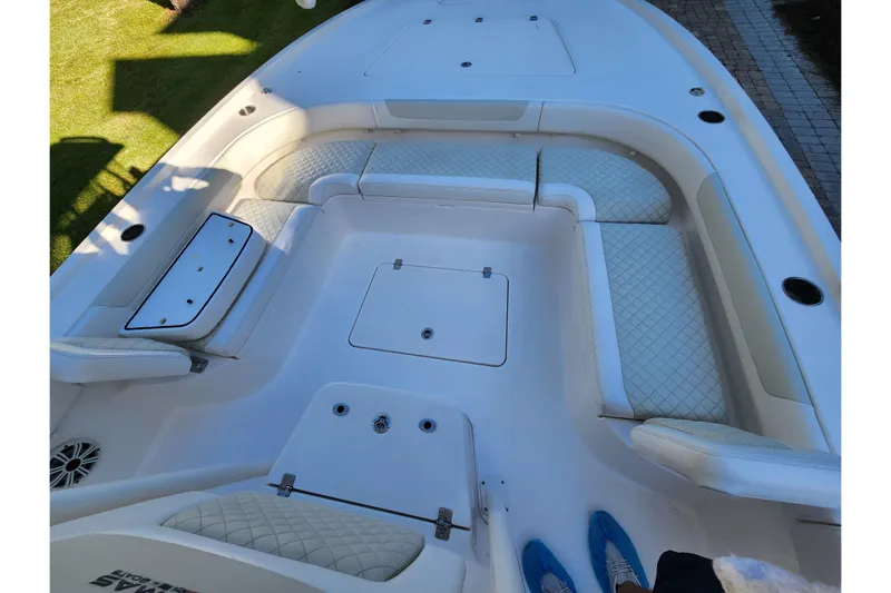  Yacht Photos Pics 2020 Caymas 28 HB boat interior with cushioned seating and storage compartments.