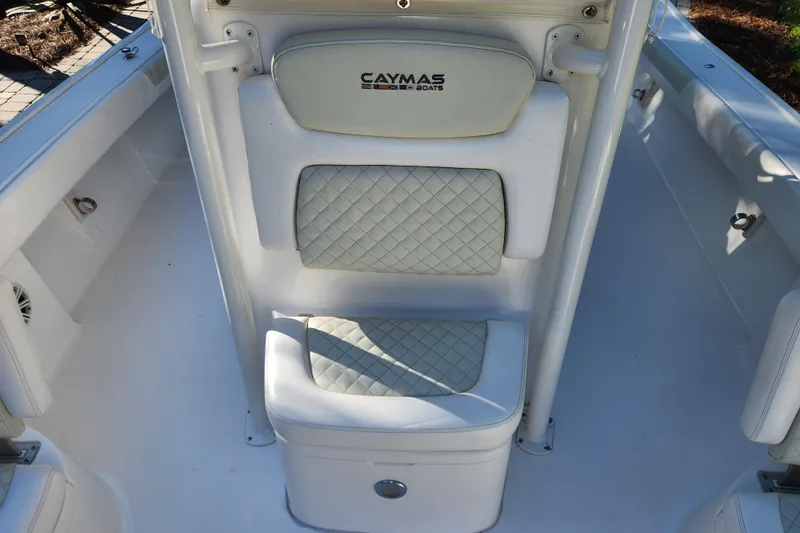  Yacht Photos Pics 2020 Caymas 28 HB boat interior with cushioned seating and storage.