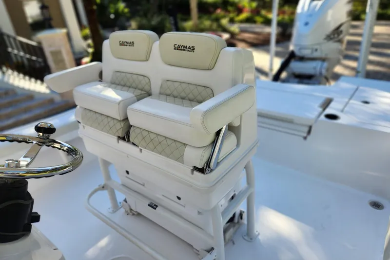  Yacht Photos Pics 2020 Caymas 28 HB boat with dual cushioned seats and steering wheel.