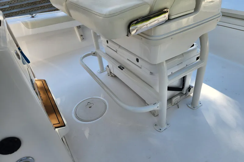  Yacht Photos Pics 2020 Caymas 28 HB boat interior with white seating and storage area.