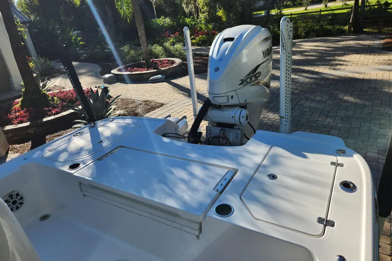  Yacht Photos Pics 2020 Caymas 28 HB boat with Yamaha XTO engine in a landscaped driveway.