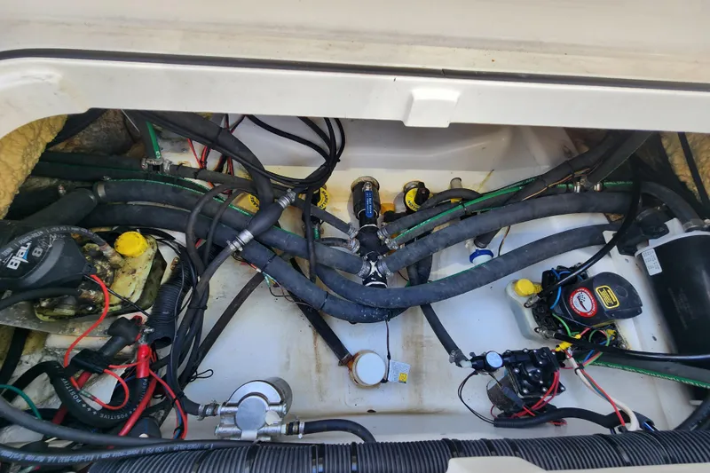  Yacht Photos Pics 2020 Caymas 28 HB boat engine compartment with wiring and hoses.